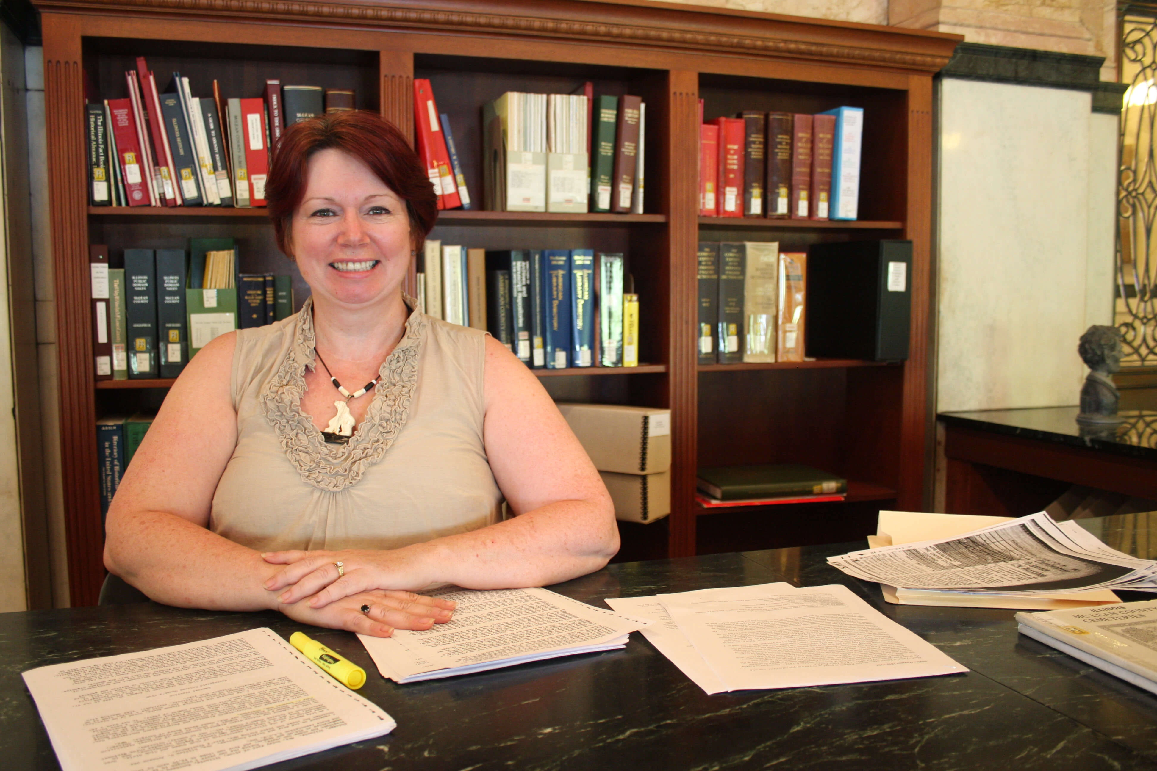 Aingeal, a volunteer at the library reference desk