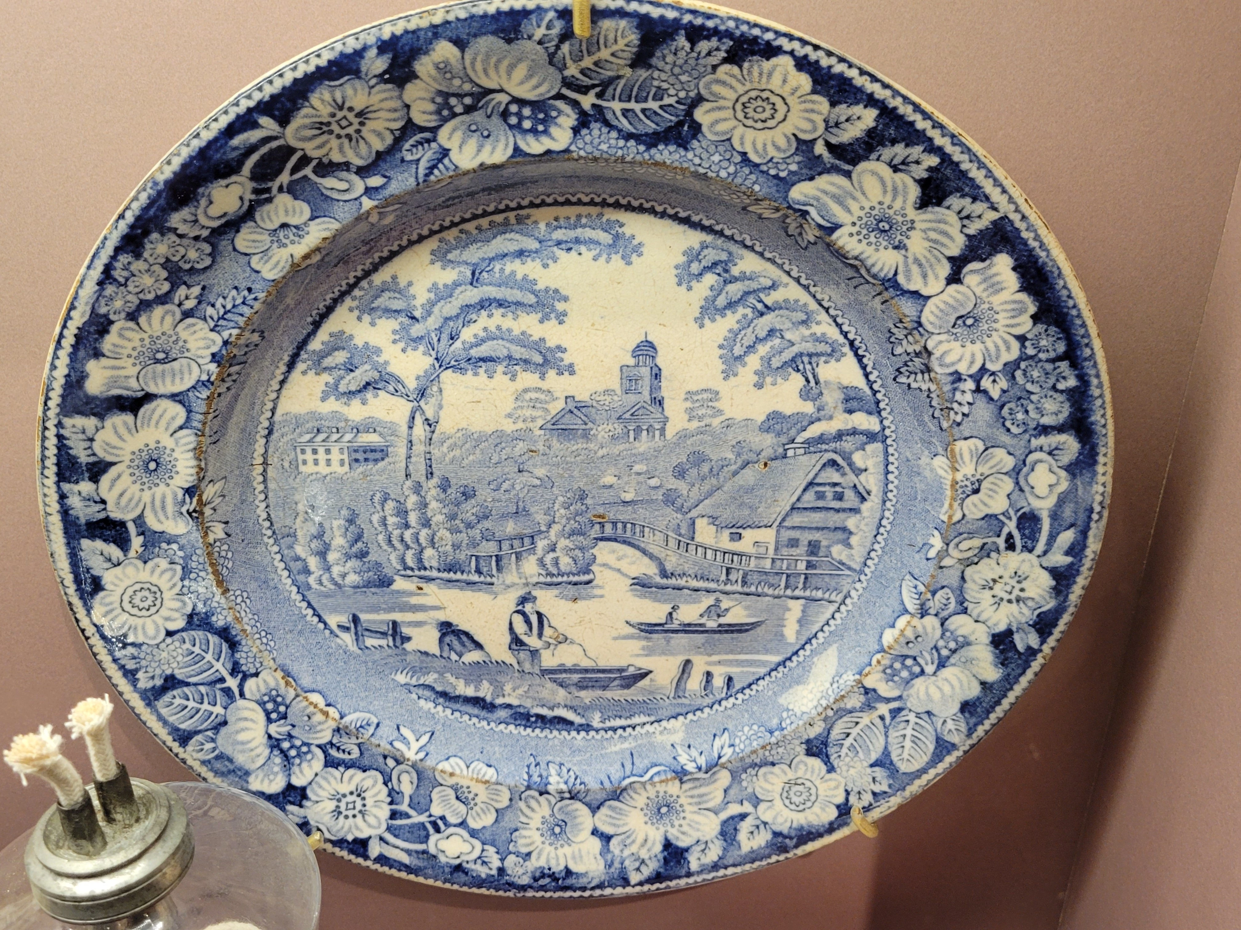 white platter with intricate cobalt blue illustration