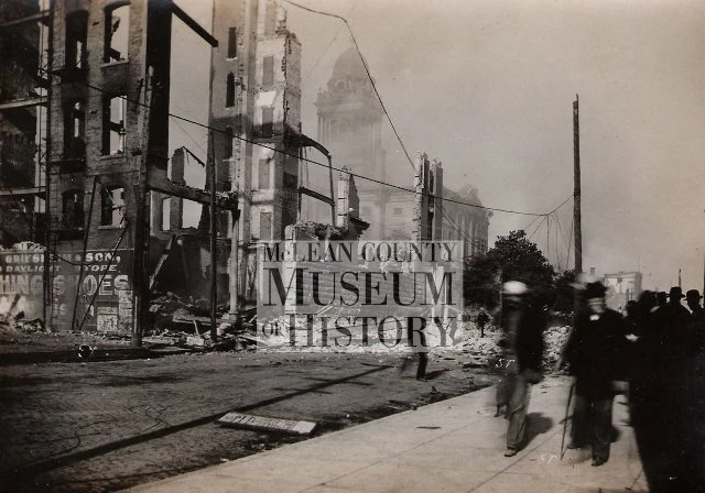 View west on Jefferson St. from East St. Fire was controlled shortly after this photograph was taken. Smoke in distance is from the last building destroyed.